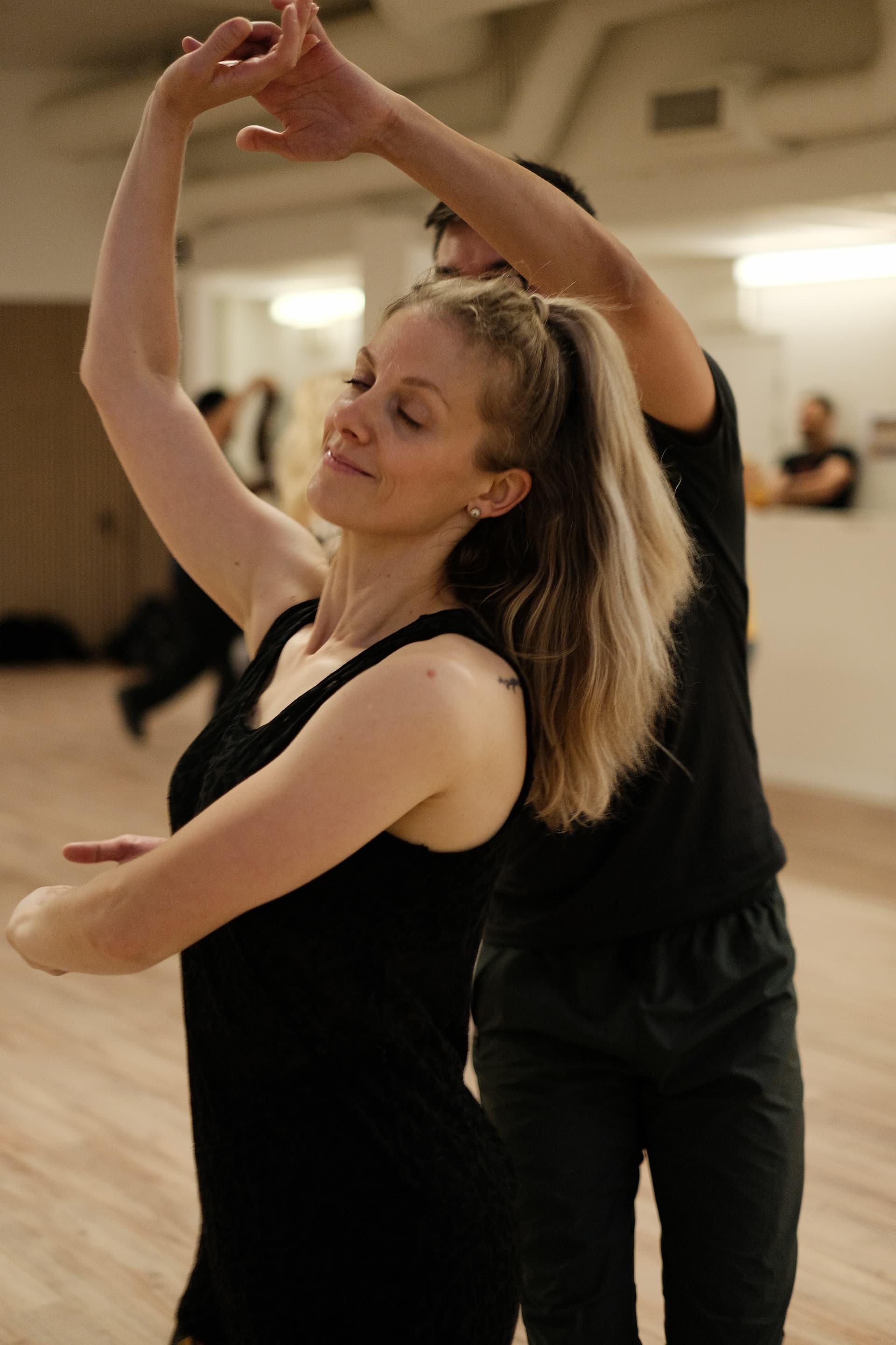 Background image of dancing couples at Fuego Dance School